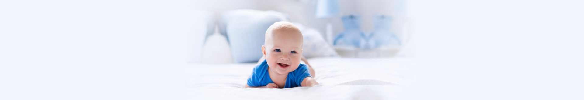 infant smiling while crawling